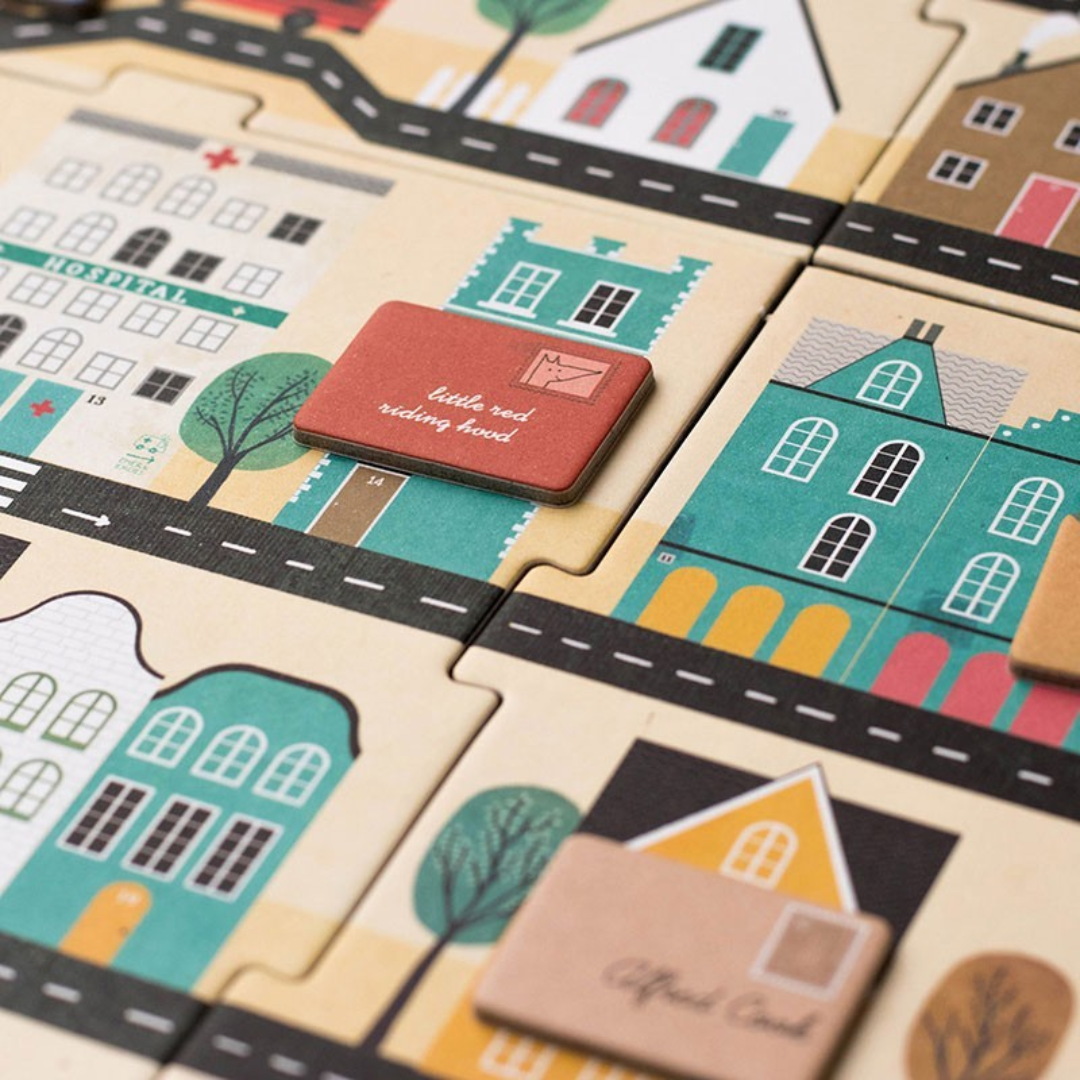 Londji A postás megfigyelő társasjáték részlet színes házakkal